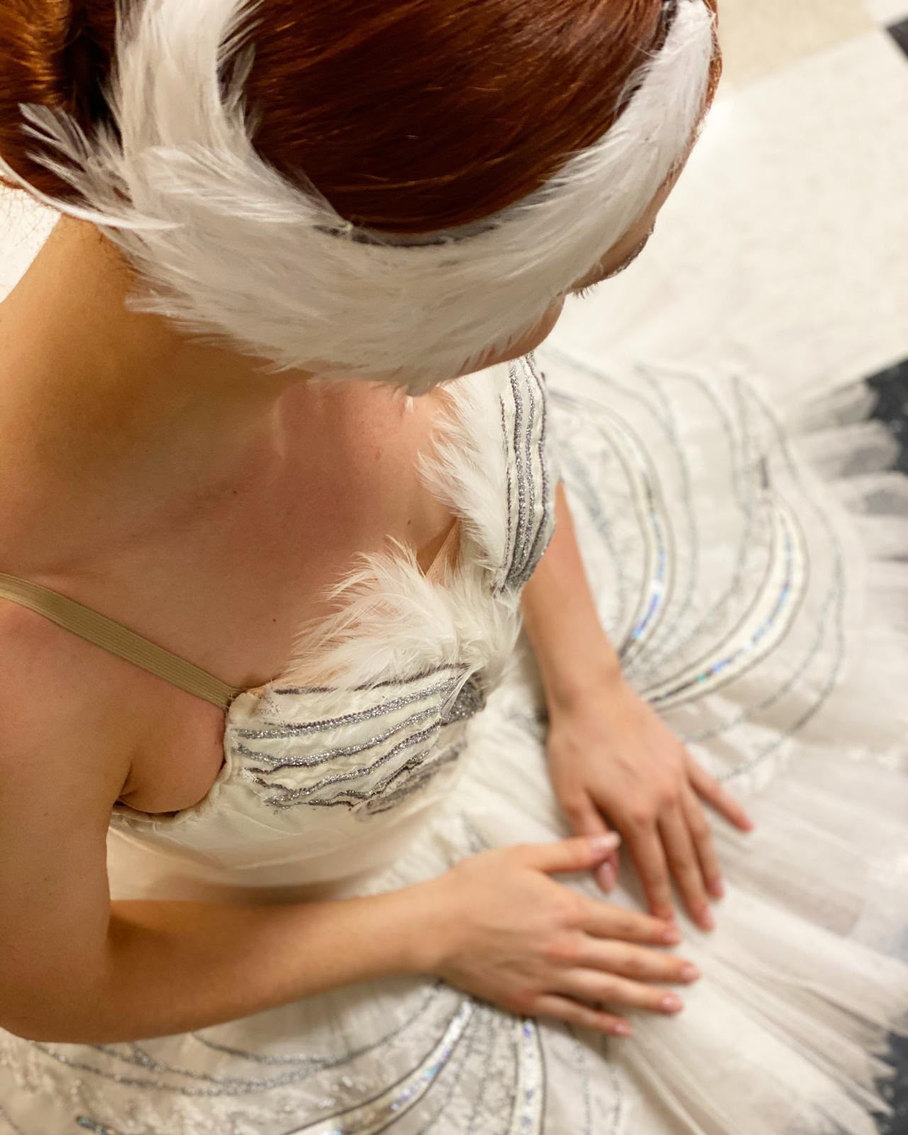 A dancer performing a classical solo before the audience.